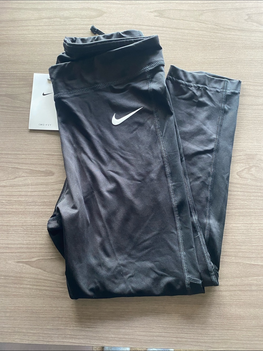 Nike Black Capris with White Swoosh Logo